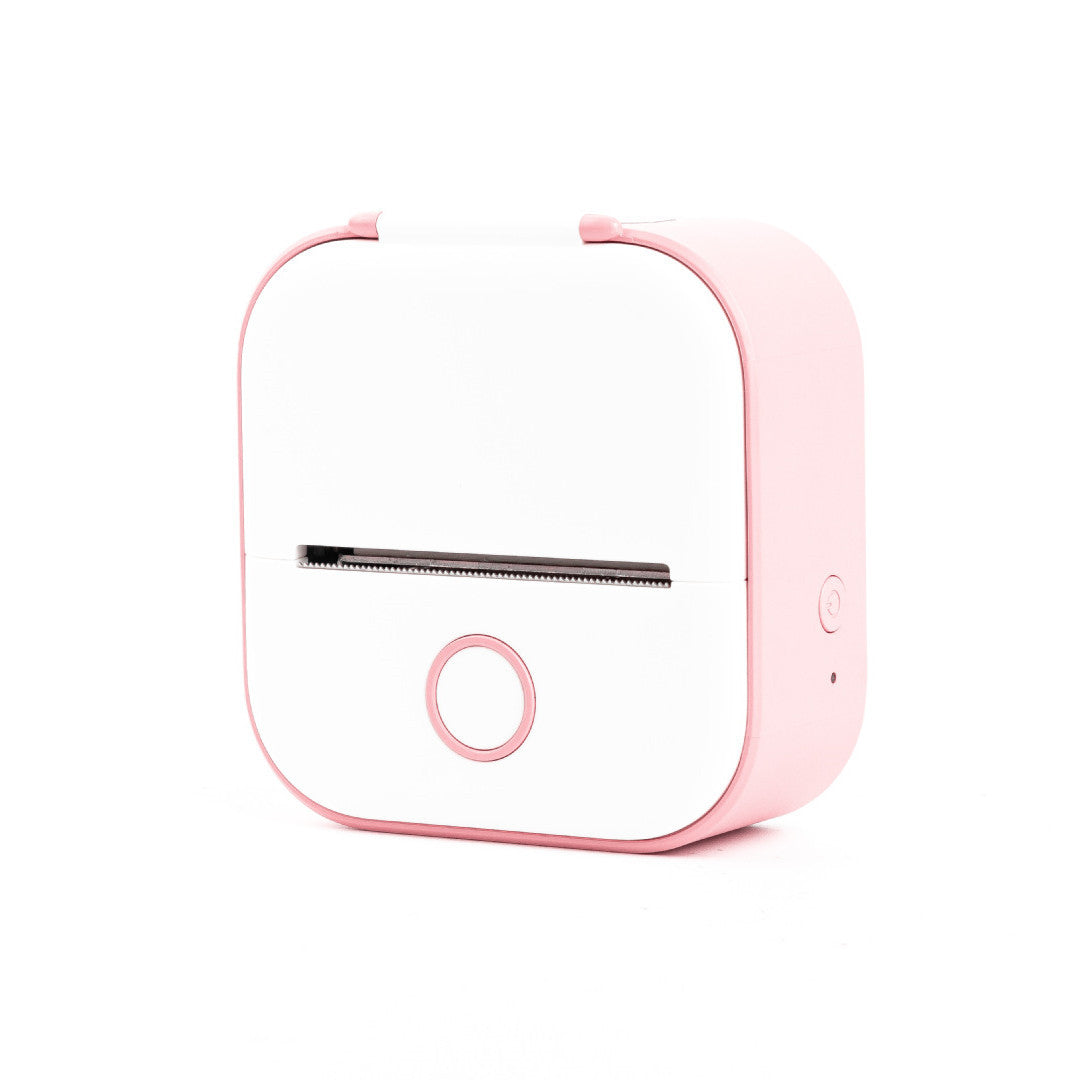 Pink and white electronic device on a white background