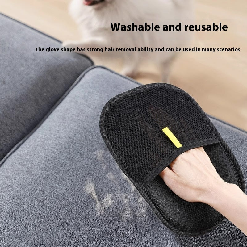 Black grooming glove with yellow handle on a gray surface, used for hair removal.