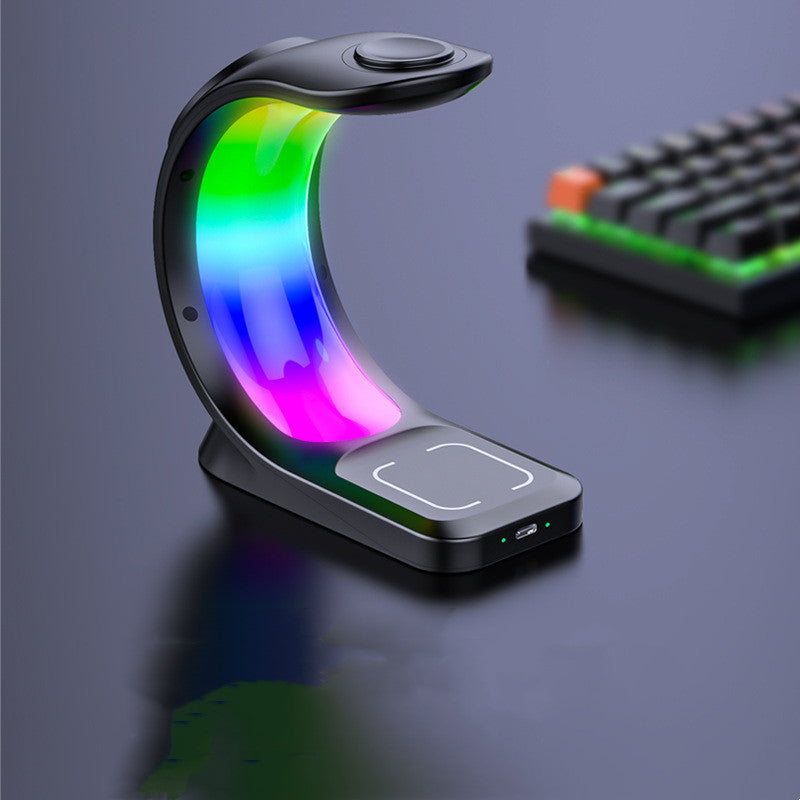 Colorful LED lamp with a keyboard in the background on a dark surface